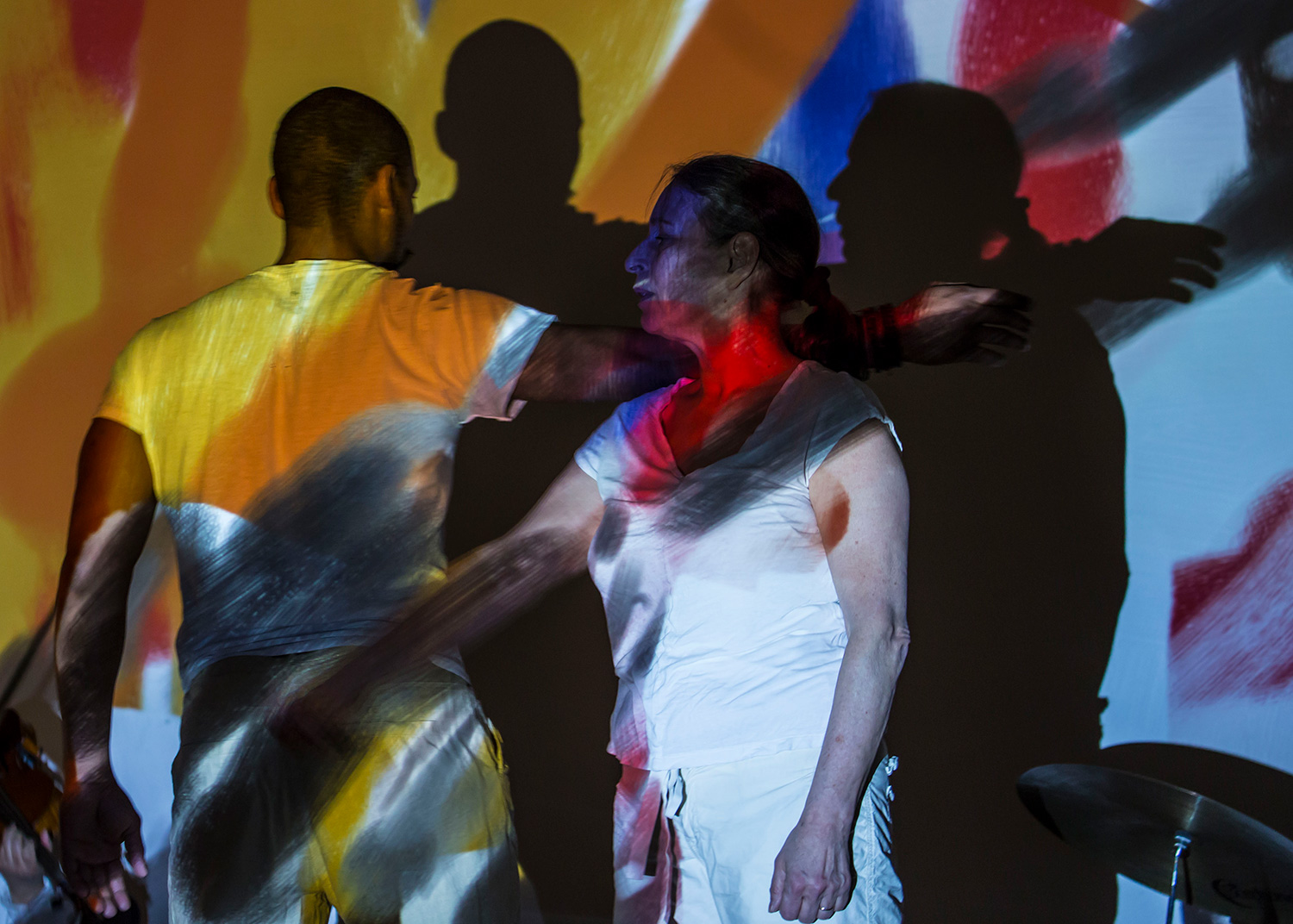 Patricia Nicholson and Jason Jordan on a colorful stage